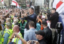 Revolution JK! Thousands Gather, Climb The Gates At 10 Downing