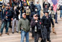 Michigan residents armed with rifles and handguns defy stay-at-home order