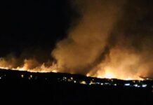 Black fencing erected to hide Lahaina truth from us all… while military men halt photography attempts
